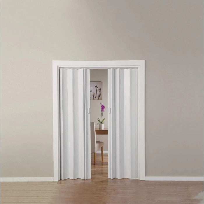 A double folding door in a white finish, open, allowing visibility into a room with a light interior.